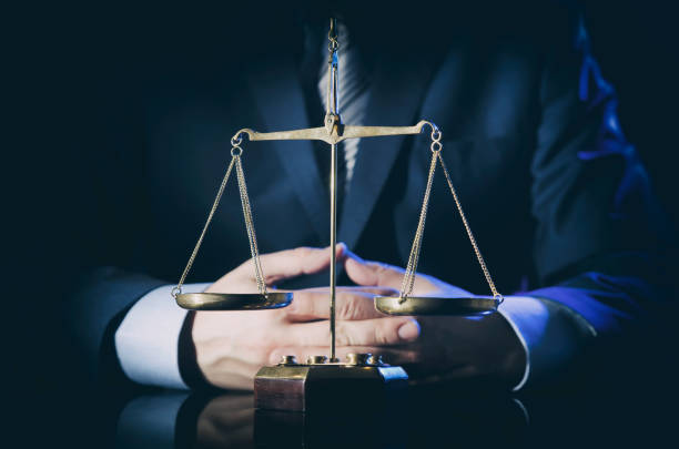 istock Weight scale of justice, lawyer in background 931776312
