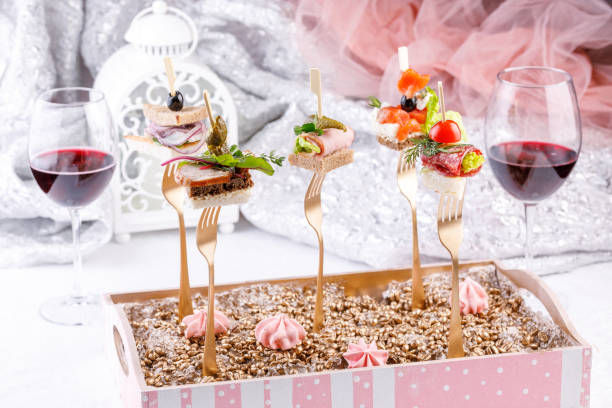 Original canapes on the forks. Appetizing still life.