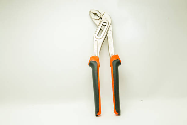 Adjustable plumbing and pipe wrench pincers. Isolated on white background.
