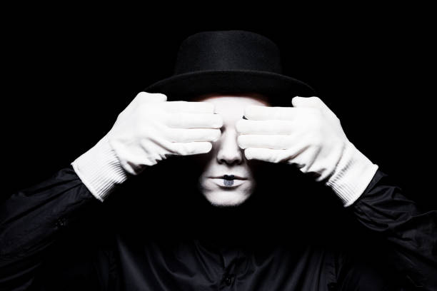 mime covering eyes isolated on black