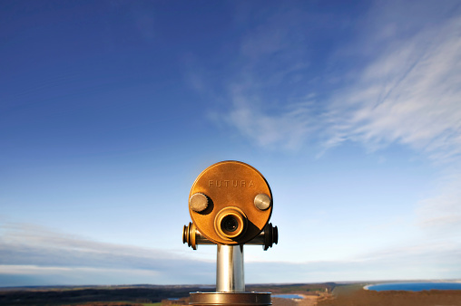 An old metal monocular that makes it easier to admire the beautiful panorama of the seaside city.