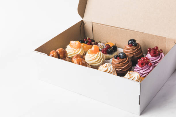 istock top view of sweet cupcakes in cardboard box 931784120