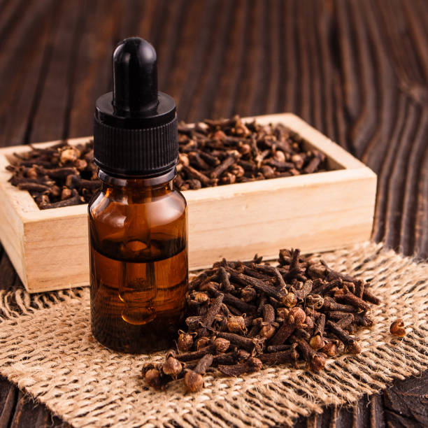 istock essential oil of cloves on a wooden rustic background 931784580