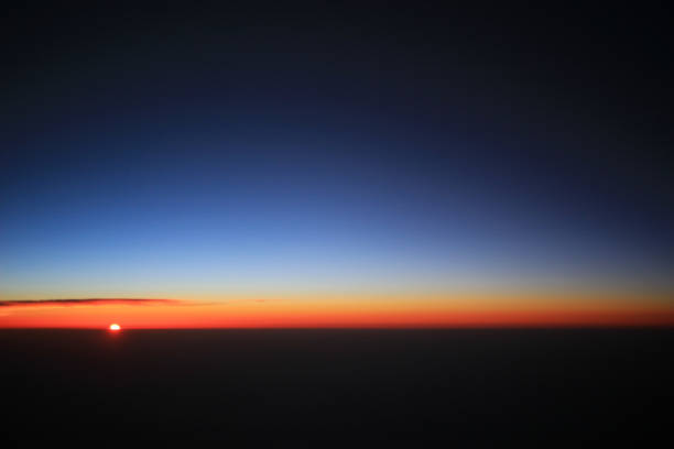 istock the sunset above clouds at the plane 931789440