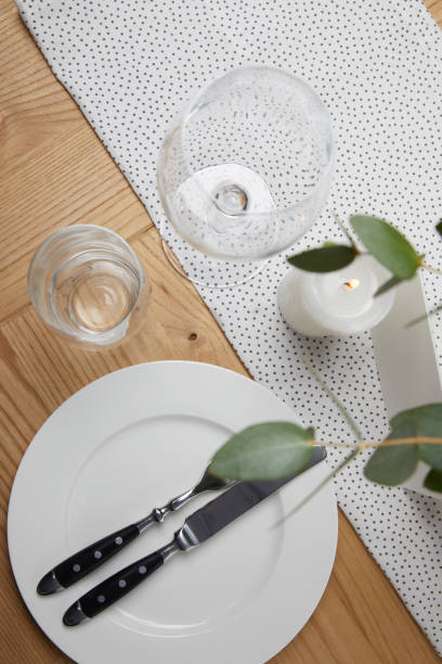 istock Festive table with cutlery on plate on table with candle 931792950