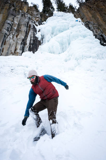 istock Man explores frozen waterfall at Hyalite Canyon, Montana 931794382