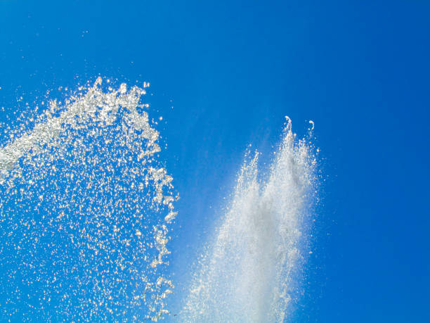 istock White water jet on blue clear sky background. 931794616