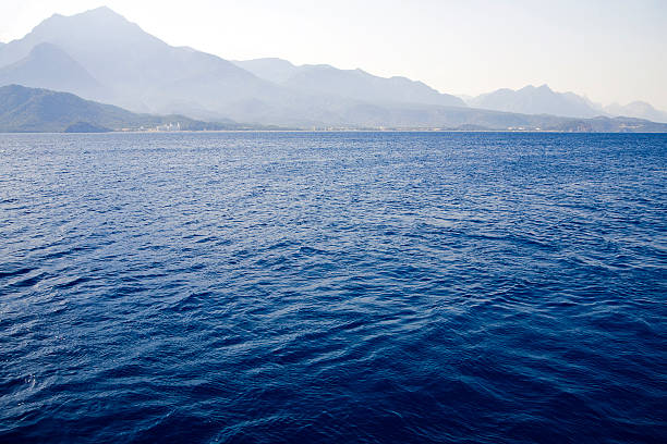 Mouse and Snake island from Kalkan Bay, Antalya, Turkey. Kalkan is a town on the Turkish Mediterranean coast near Kaş and an important tourist destination in Antalya, Türkiye