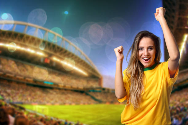 Brazilian fan cheering at the stadium stock photo