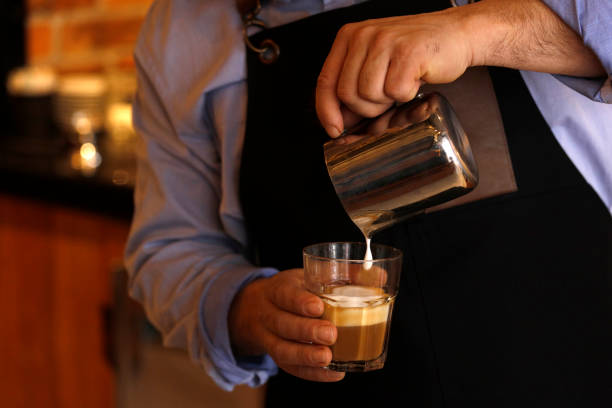 istock Creating latte art on long coffee with milk 931808760