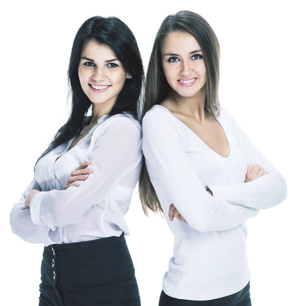 istock Two young successful attractive business woman isolated white background 931812178