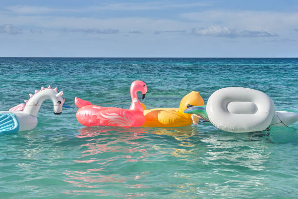 istock Children's inflatable wheels on the sea water 931815008