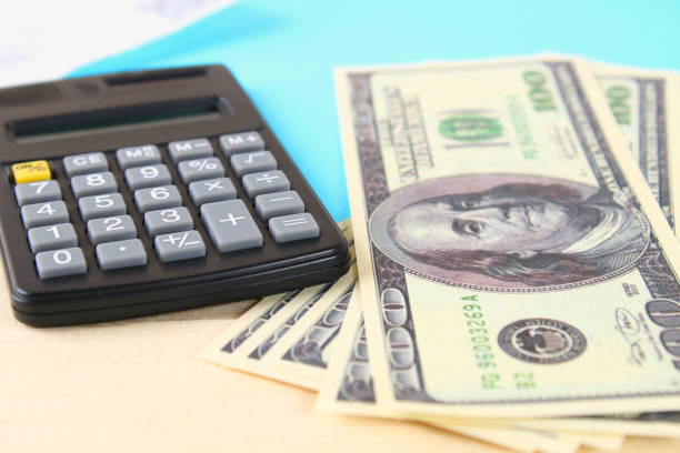 istock Finance concept : The United States hundred-dollar bills , calculator , bills. 931820066