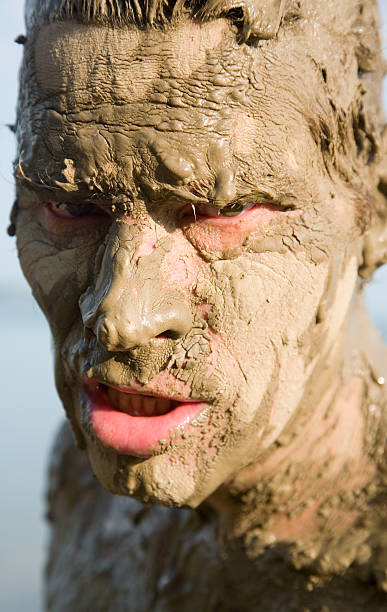 istock Man's face is very dirty in the mud 93182016