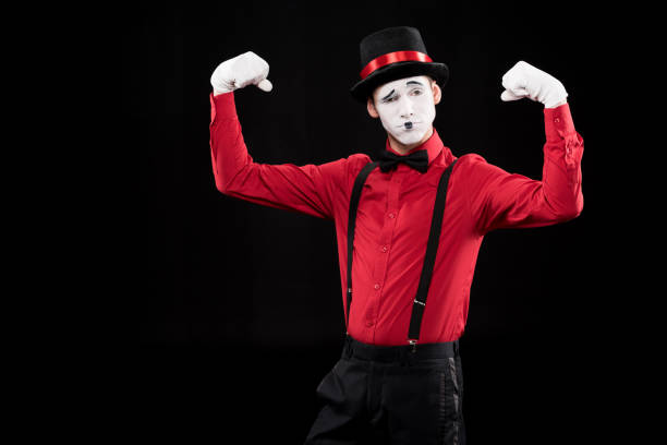 istock mime showing muscles isolated on black 931821050