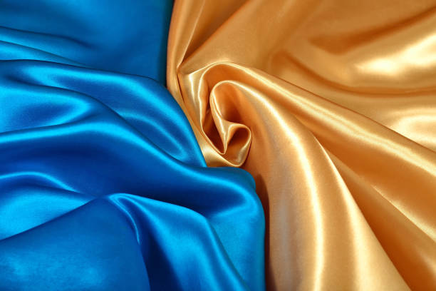 istock Natural golden and blue satin fabric texture 931824760