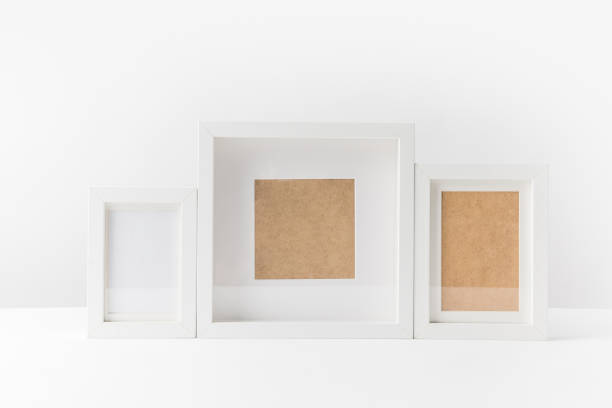 istock close-up view of various empty white photo frames on white 931825280