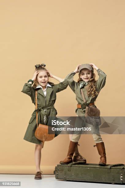 Two Beautiful Girls On A Pastel Background Stock Photo - Download Image Now - Child, Safari, Party - Social Event