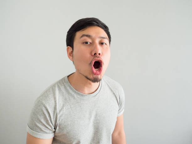 istock Funny face of bad breath man. 931840042