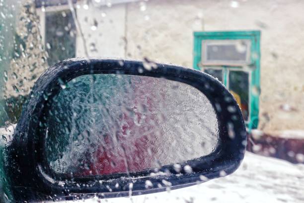 icy side mirror of a car. - snow driving side view mirror rain imagens e fotografias de stock