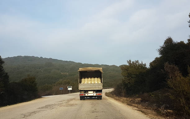 istock milk trasportation lorry road sky  plastic white can 931849374