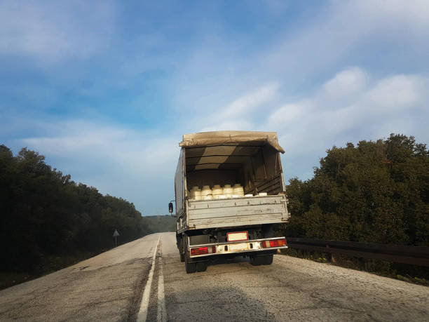 istock milk trasportation lorry road sky  plastic white can 931849588