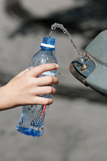 istock hand filling a bottle water fountain 93185259