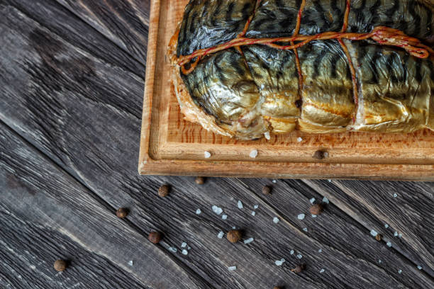 istock On a wooden background smoked fish. 931854216