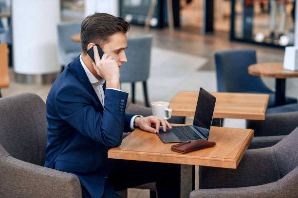 istock Successful businessman makes a business plan. Workplace with laptop, wallet and notebook. 931855300