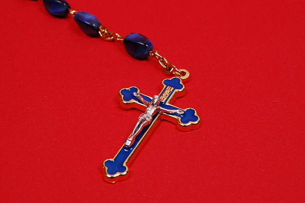 shadow of crucifix cross in red and black bokeh background for inspiration