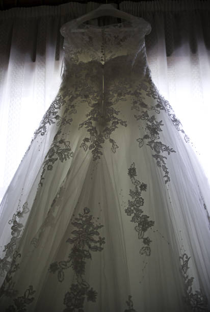 istock Wedding dress hanging 931859592