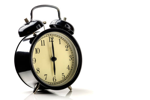 istock black vintage alarm clock isolated on white background show time at six o'clock 931860208