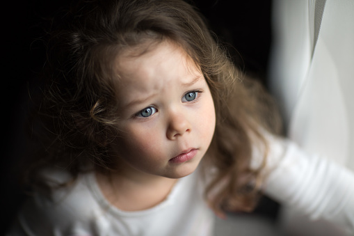 Argentinean 6 years-old boy portrait playing outside