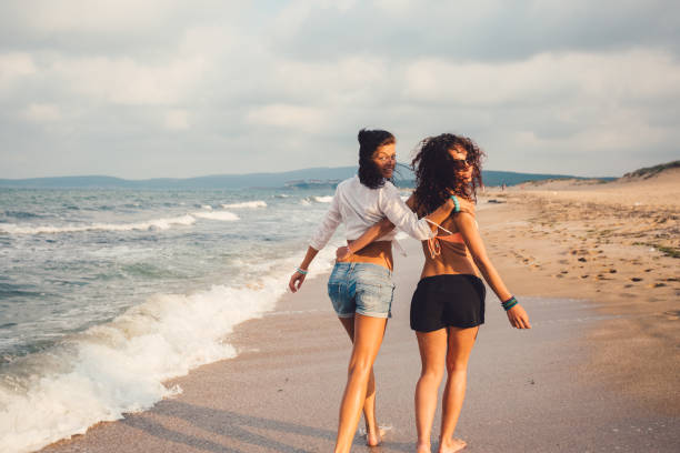 istock Happy girls at the beach 931879318