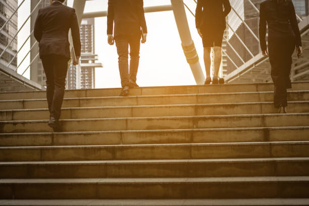 istock Business peoples walk on step, meaning aiming to goal fo success 931879892
