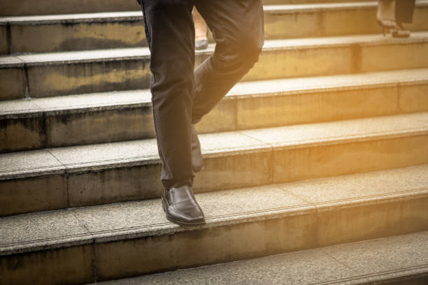 istock Business peoples walk on step, meaning aiming to goal fo success 931879904