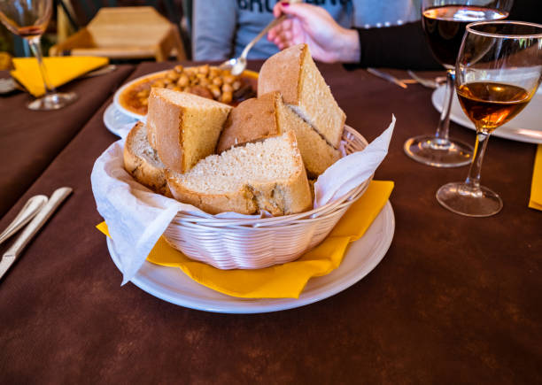 istock Spanish food. A basket with traditional rustic bread 931884446