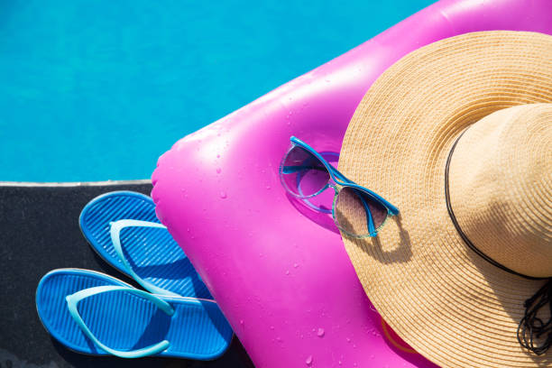 istock slippers sunglasses straw hat pink air mattress 931903152