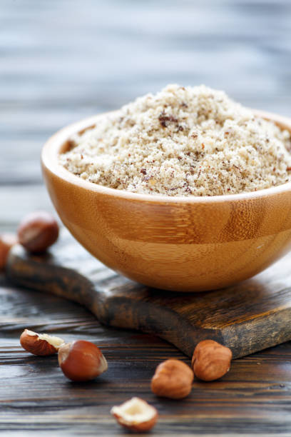 istock Hazelnut flour in a wooden bowl. 931906126