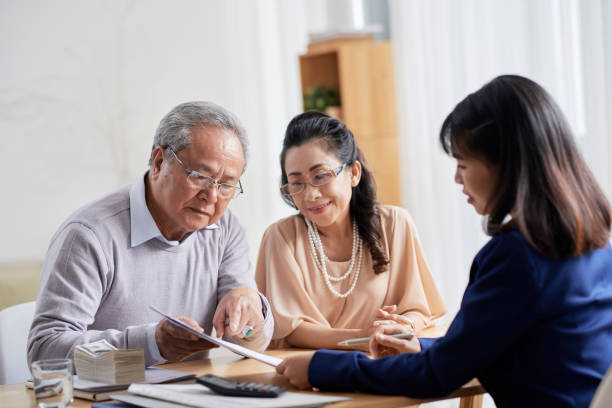 istock Discussing Terms of Purchase Agreement 931906758