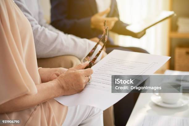 Studying Life Insurance Policy Stock Photo - Download Image Now - Senior Adult, Planning, Document