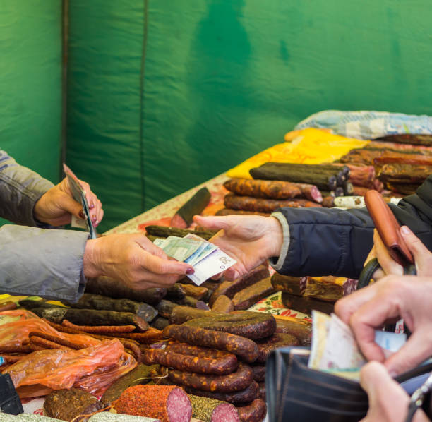 Customer paying for the sausages