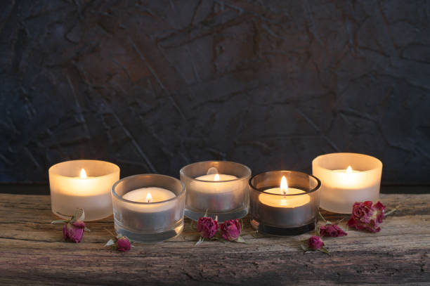 istock Burning candles on weathered wood 931914188