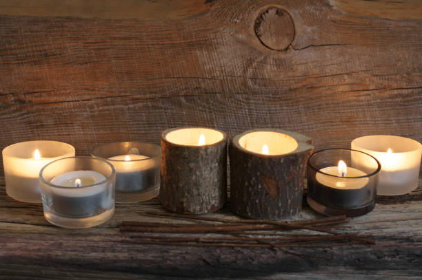 istock Burning candles on weathered wood 931914190