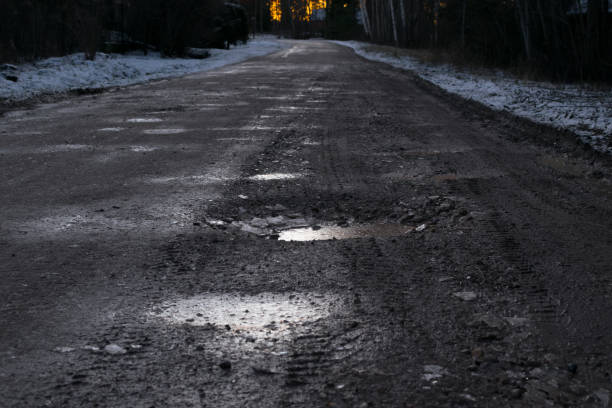 istock beautiful winter landscape with road to sunset 931926318
