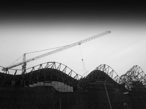 istock Diagonal black and white construction crane city background 931930204