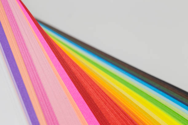 istock Multicolored quilling paper curved stripes forming a bright background. 931933796