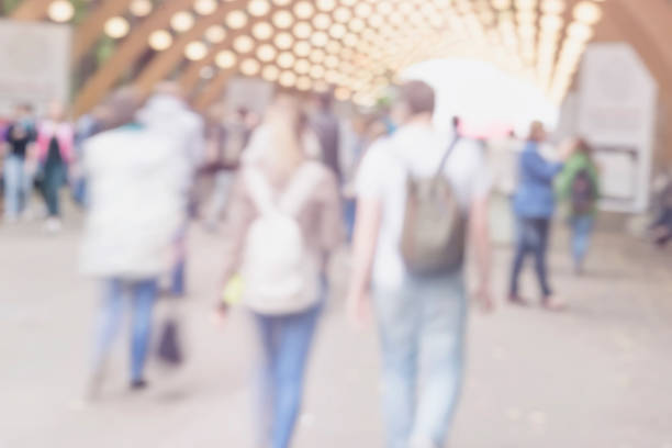 istock Walking happy young couple in park with backpacks. Blurred abstract image for creative light background, pantone fashion colors. Concept modern city, love, lifestyle 931934072