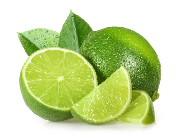 lime isolated on white background - lime green imagens e fotografias de stock