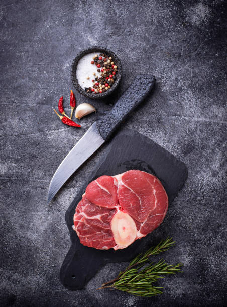 istock Raw meat osso buco on slate cutting board 931938564